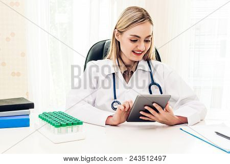 Female Doctor And Stethoscope Working With Tablat Computer In Hospital.healthcare And Medicine
