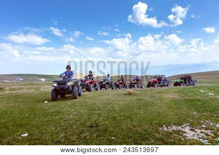A Tour Group Travels On Atvs And Utvs On The Mountains.