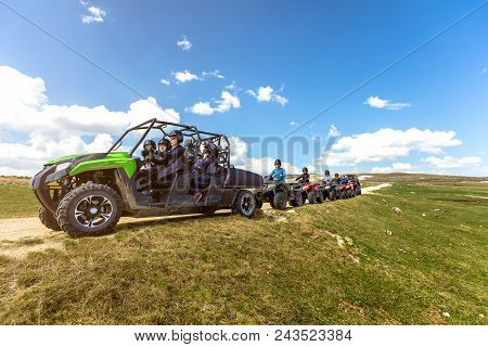 Friends Driving Off-road With Quad Bike Or Atv And Utv Vehicles.