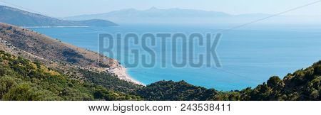 Adriatic Sea Summer Coast With Beach And Corfu Island In Mist (lukove Komuna, Albania). View From Mo