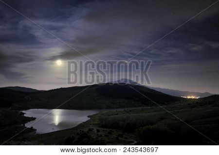 moonlight reflection on Trearie Lake in Nebrodi Park, Sicily