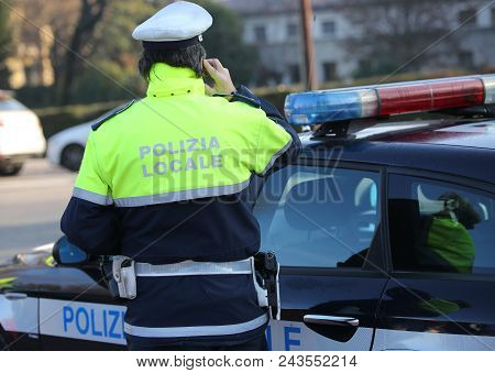 Italian Policeman With The  Text Polizia Locale That Means Local Police In Italian Language Uses The
