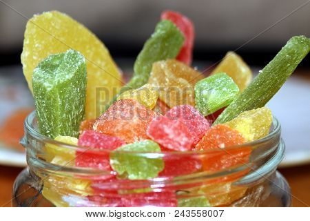 Succade Fruit Dried Fruits In A Glass Jar, Close-up.