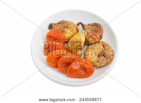 Dried Fig Fruits And Dried Apricots On The White Saucer On A White Background