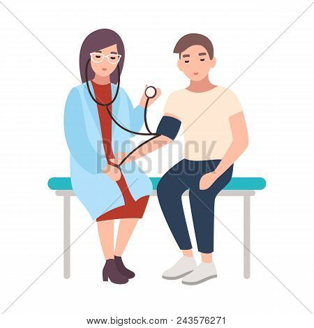 Female Doctor Or Medical Adviser Sits Hospital Bench And Measures Blood Pressure Of Male Patient Iso