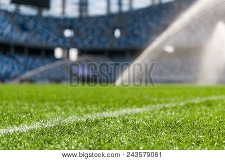 Irrigation Turf. Sprinkler Watering Football Field Close-up