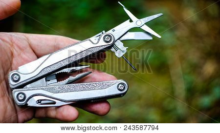 Multi Tool In A Hand, Close Up Man Hand Using Standard Multimeter Tools