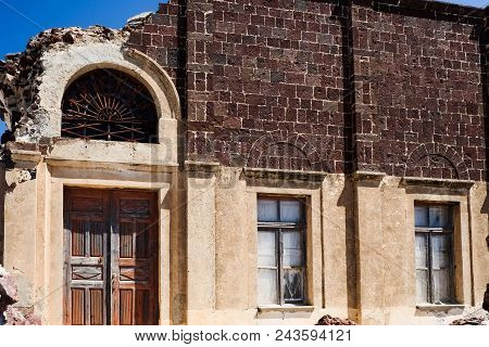 Main Door Entrance Against A Blue Summer Sky. Santorini Greece