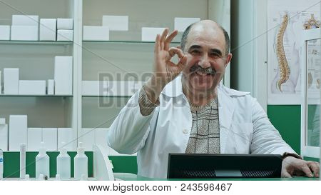Happy Male Pharmacist Showing Allright Sign And Stumb Up Smiling