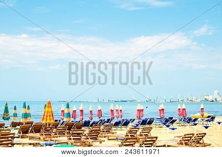 Aerial View To Sandy Beach Of Adriatic Sea In Albania, Full Of Umbrellas And Sunbeds, Port Of Durres