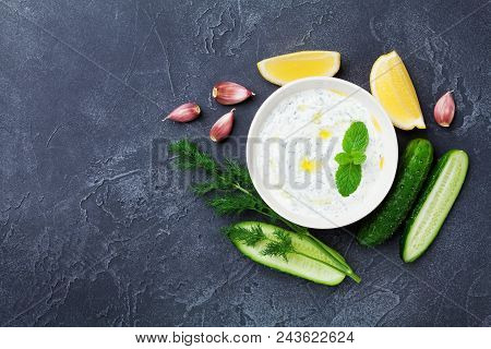 Dip Or Sauce Tzatziki From Greek Yogurt With Ingredients Cucumber, Dill, Lemon, Mint And Garlic On B