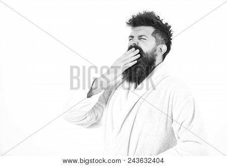Good Morning. Man With Beard And Mustache Yawning And Covering Mouth With Palm, Isolated On White Ba