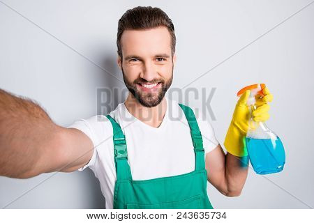 Self Portrait Of Cheerful Joyful Cleaner With Stubble In Uniform Shooting Selfie On Front Camera Hav