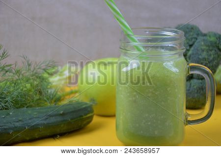 Detox Healthy Green Smoothie In Mason Jar With Ingredients: Spinach, Celery, Cucumber, Lettuce, Ging