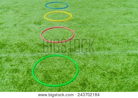 Colored Hula Hoops At Playground Field On Grass