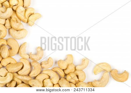 Corner Of Raw, Organic, Whole Cashew Nut Kernels Over White Background