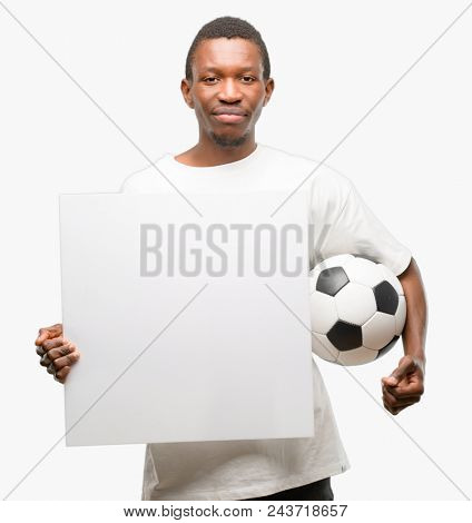 African black man wearing sungla holding blank advertising banner, good poster for ad, offer or announcement, big paper billboard