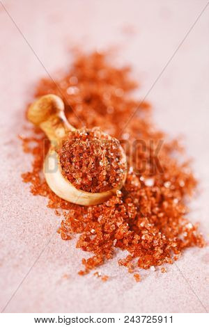 Hawaiian Red Gold Salt with wooden spoon on pink marble