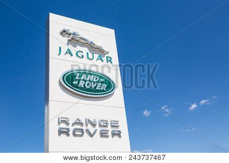 Moscow, Russia - May, 2018: Jaguar And Land Rover Logo Sign Against Blue Sky. Jaguar And Land Rover 