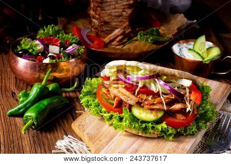 Crunchy Pita With Grilled Gyros Meat. Various Vegetables And Garlic Sauce
