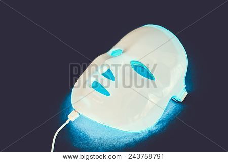 Light Rejuvenating Mask For Facial Skin Therapy On Black Background