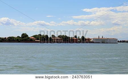 Small Island In The Adriatic Sea With The Buildings Of An Old Mental Ospital Called San Servolo Near