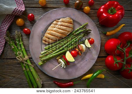 grilled chicken breast with brochette vegetable with grill asparagus