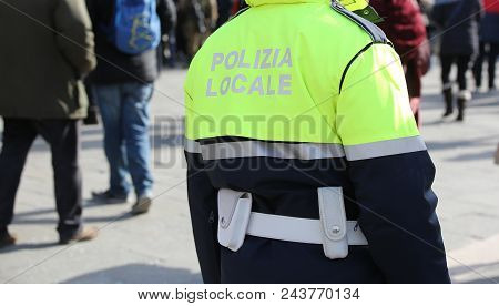 Policeman With Uniform And The Text Polizia Locale That Meas Local Police In Italian Language