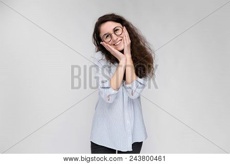 Happy Young Girl In A Light Blouse And Dark Pants.