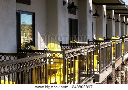 Yellow Chairs On Balconies In Morning Light, Old Town Cottonwood Arizona.