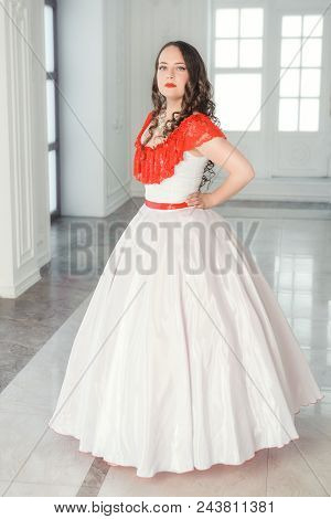 Beautiful Woman In Medieval Dress With Crinoline In The Hall
