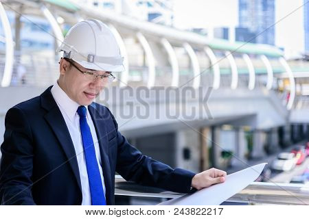 Asian Business And Engineer Man Has Planning And Working For Design Buiding And City.