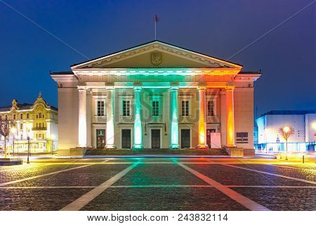 Town Hall Square In Old Town Illuminated By The Colors Of The National Lithuanian Flag At Night Of V