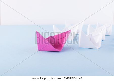 One Unique Pink Paper Boat Among Many Ones. Different Paper Ships As Individuality And Leadership Co