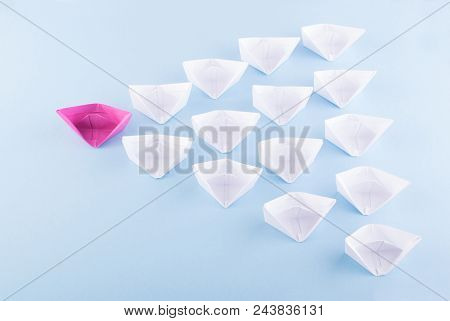 One Unique Pink Paper Boat Among Many Ones. Different Paper Ships As Individuality And Leadership Co