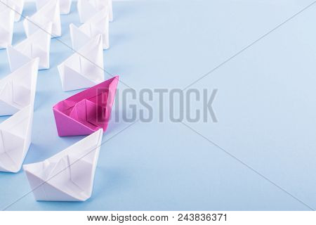 One Unique Pink Paper Boat Among Many Ones. Different Paper Ships As Individuality And Leadership Co
