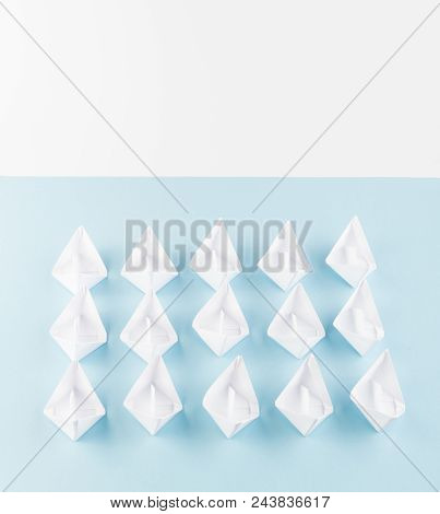 White Paper Boats Or Paper Ships Origami On Blue Background