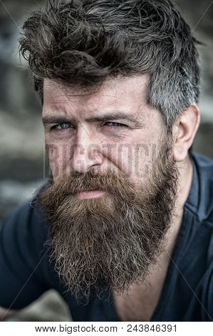 Man With Beard And Mustache, Close Up. Bearded Man On Serious Face Looks Sad And Troubled, Suffers F