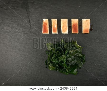 Wakame Seaweed On Natural Stone Background. Healthy Algae Food With Soy Sauce And Tofu