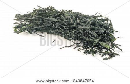 Heap Of Dry Wakame Seaweed Isolated On White Background. Healthy Algae Food