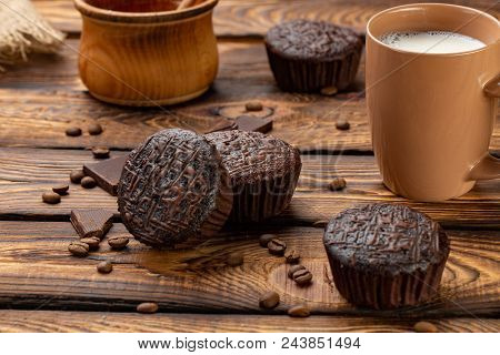 Chocolate Muffins On A Broun Rustic Wooden Table - Selective Focus. Brackfast