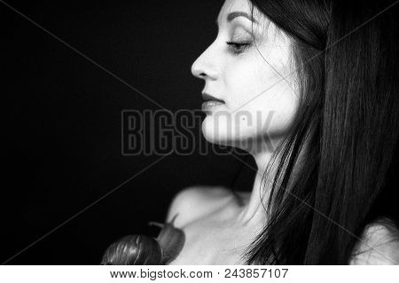 Side View Of Young Woman With Dark Hair Receiving Snail Neck Massage In Studio.