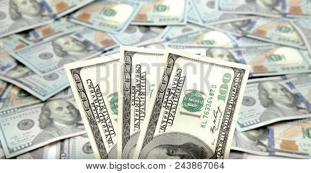 Old One Hundred Dollars Against The Background Of The New Ones.