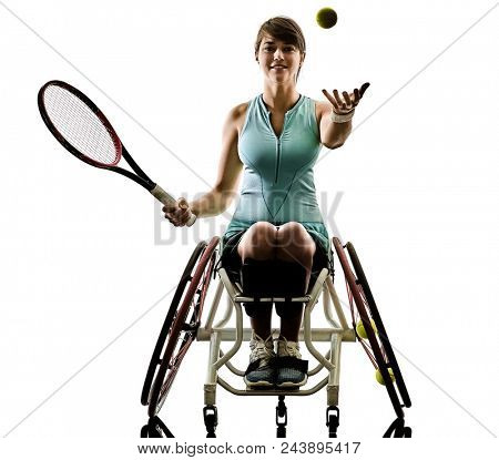 one caucasian young ped tennis player woman in welchair sport tudio in silhouette isolated on white background