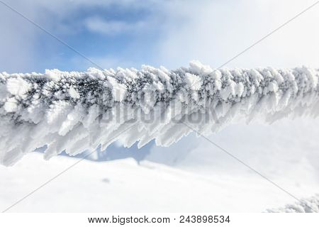 Detail On Snow And Ice Covered Stairs Fence Illustrating Extreme Cold In The Winter.