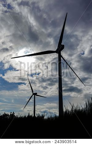 Wind turbine generators on top a hill for the production of clean and renewable energy near Fafe, Portugal