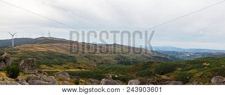 Wind turbine generators on top a hill for the production of clean and renewable energy near Fafe, Portugal