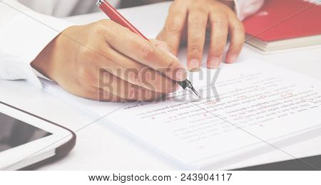 Proofreading Paper On White Table In Office
