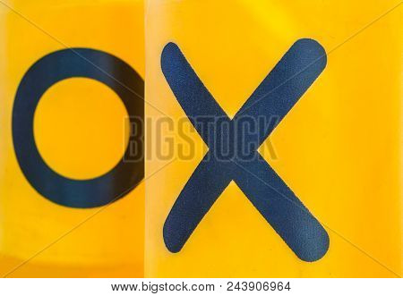 Rotating Plastic Yellow Cylinders With A Play Of Tic-tac-toe For Children Entertainment