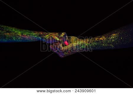 Concept Of Connecting Hands Creative Shooting In Neon Light Male And Female Palms Together